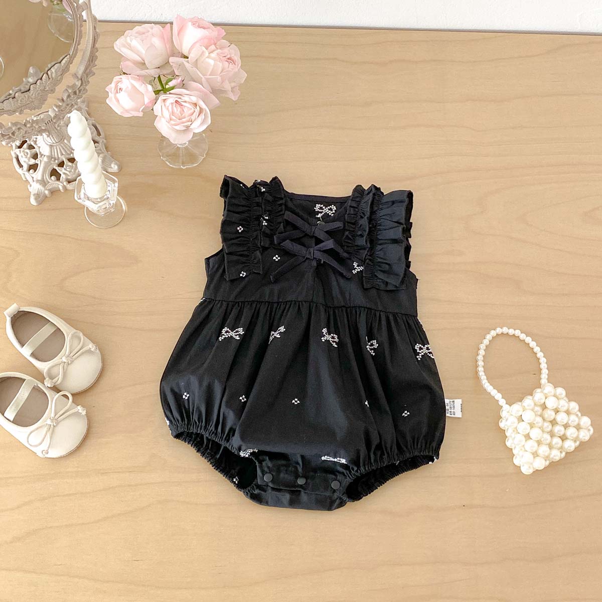 Baby Clothing Online - ชุดรอมเปอร์เด็กผู้หญิงสีดำพิมพ์ลายโบว์ แขนกุด จั๊มสูทระบาย ดีไซน์ไขว้หลัง ชุดบอดี้สูทฤดูร้อน